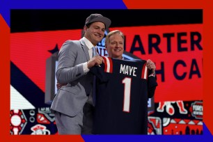 New England Patriots quarterback Drake Maye (L) poses with NFL Commissioner Roger Goodell at the Draft.