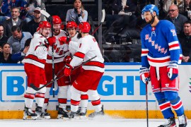 Jordan Staal and teammates from the Carolina Hurricanes celebrating his third period goal against the New York Rangers during the 2024 Stanley Cup Playoffs