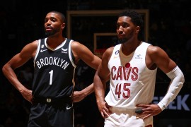 Donovan Mitchell #45 of the Cleveland Cavaliers and Mikal Bridges #1 of the Brooklyn Nets stand on the court during the game on March 21, 2023 at Barclays Center in Brooklyn, New York.