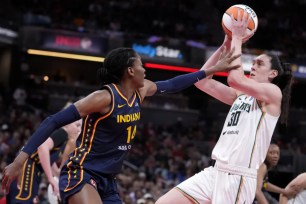 Breanna Stewart, who scored 31 points, shoots over Temi Fagbenle during the Liberty's 102-66 blowout win over the Fever.