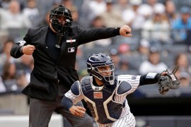 New York Yankees catcher Jose Trevino, right, and home plate umpire John Libka, left, react after Tampa Bay Rays' Isaac Paredes struck out during the first inning of a baseball game Sunday, April 21, 2024, in New York.